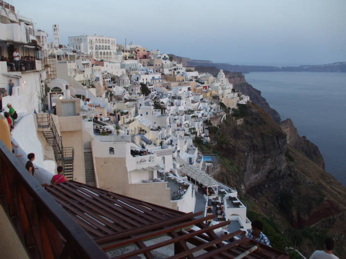 Sunset over the cafes overlooking the caldera on the Greek island of Santorini.
