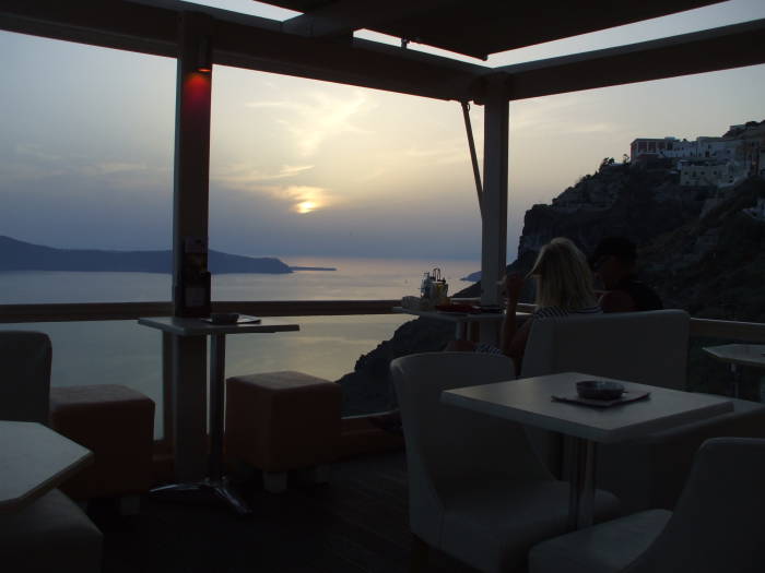 Sunset as seen from a cafe overlooking the caldera on the Greek island of Santorini.
