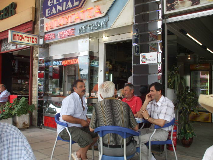 Men gathered for breakfast at a Greek coffee shop in Thessaloniki.