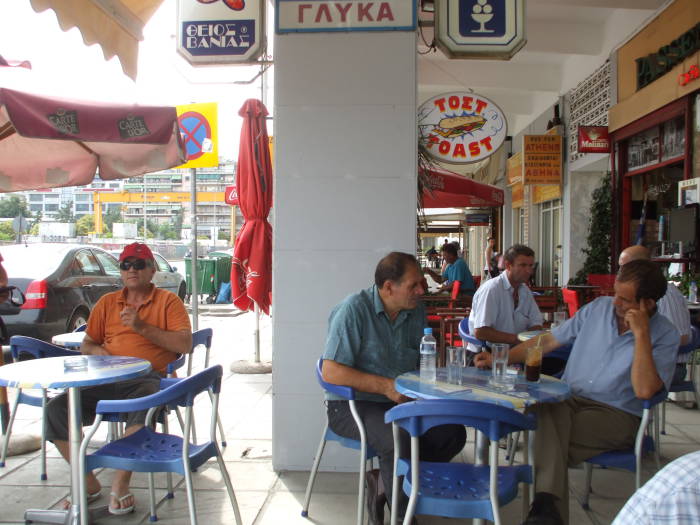 Men gathered for breakfast at a Greek coffee shop in Thessaloniki.