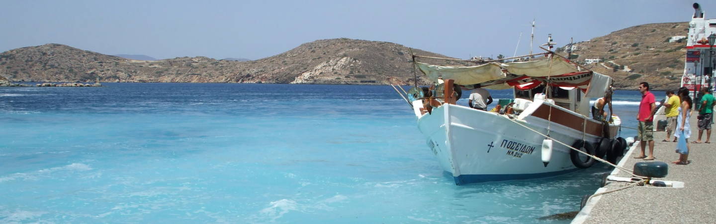 Fishing boat in the harbor on Ios island.