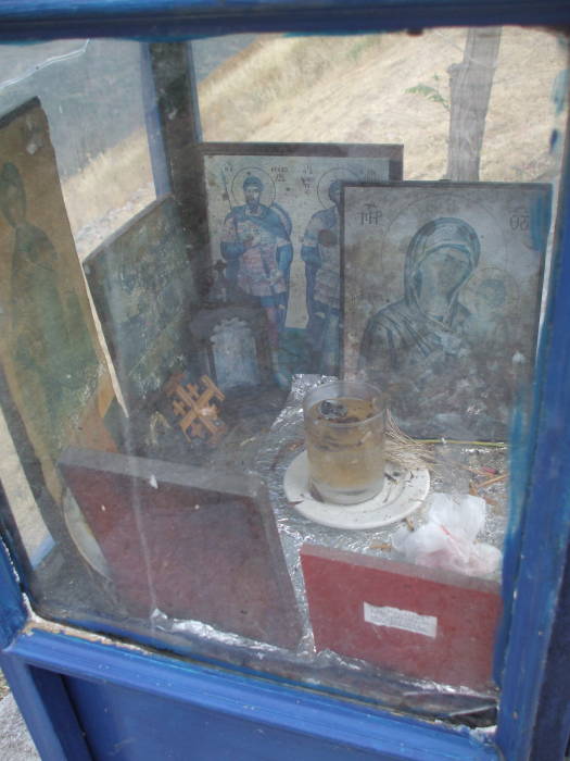 Oil lamp and icons in a Greek Orthodox shrine at Delphi.