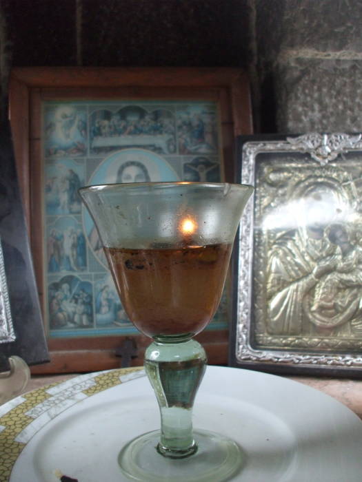 Icons and oil lamp in a Greek Orthodox shrine in Argos.