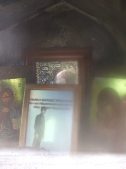 Icons and picture of the deceased in a Greek Orthodox shrine outside Nafplio.