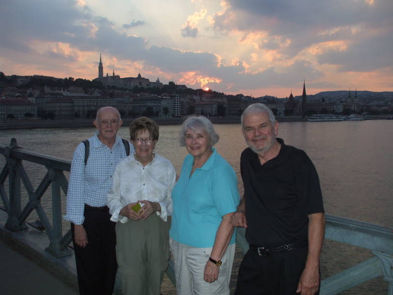 Group of travelers on the Chain Bridge across the Danube in Budapest.