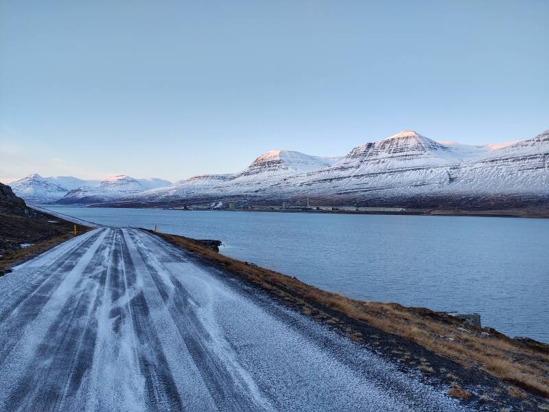 Driving Road 955 along Reyðarfjörður fjord, the Fjarðaál aluminum smelter on the opposite shore.