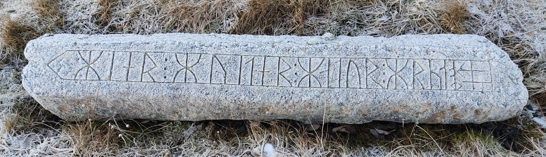 Ancient grave marker with runes near Borganes in southwestern Iceland.