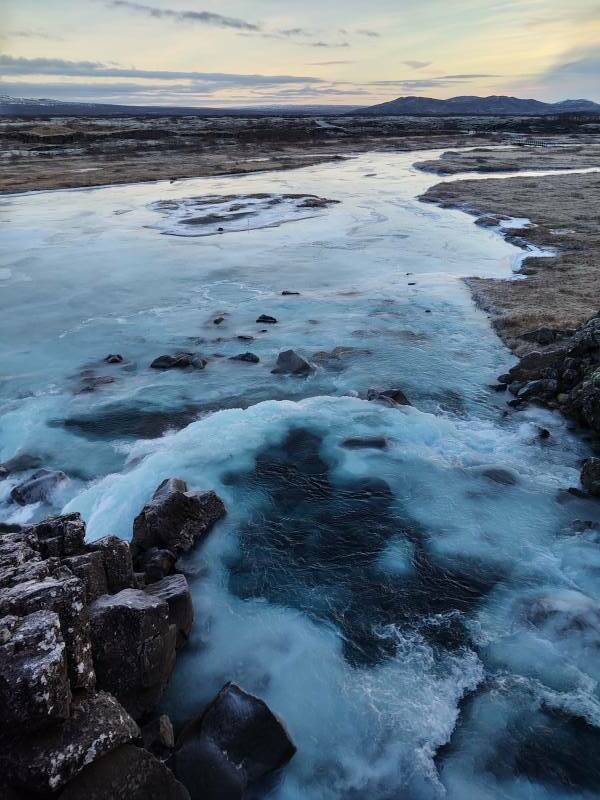 Partially frozen river at Þingvellir.