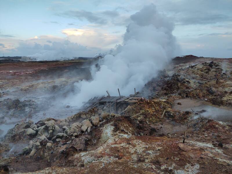 The old wooden walkway has collapsed into the boiling water and mud at the Gunnuhver hot springs.