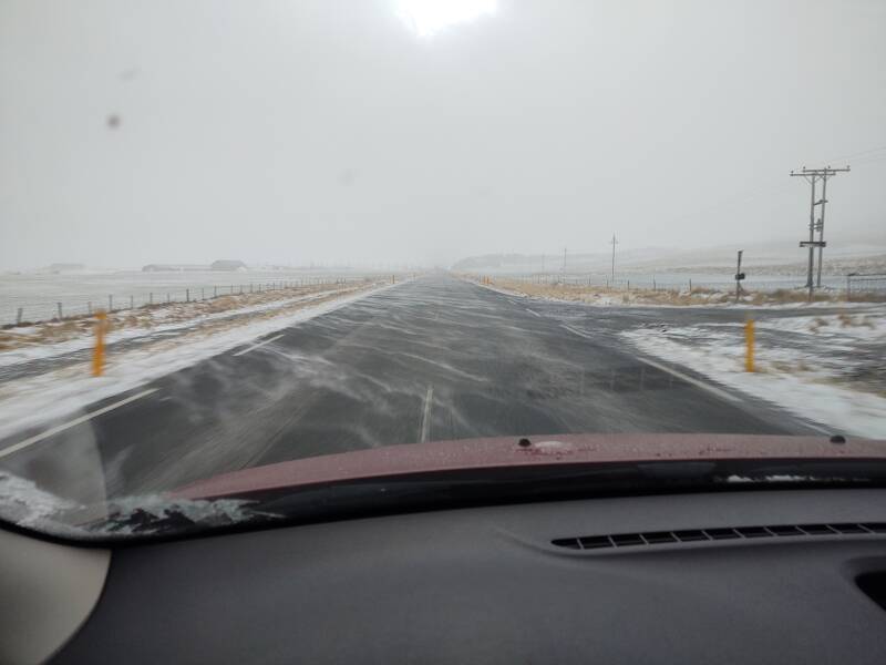 Powdery snow blows across the road on Highway 75 south from Sauðárkrókur to Varmahlíð.