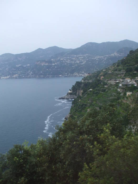 A narrow twisting road high above the rugged Tyrrhenian Sea coast.