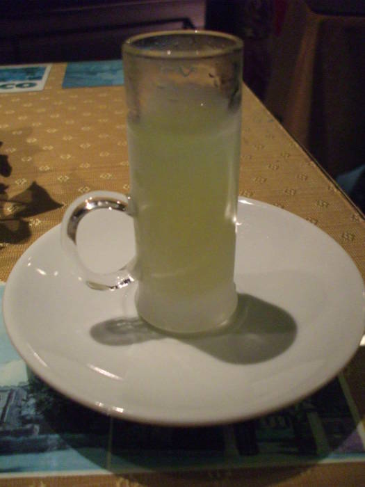 A small frosted glass of chilled limoncello.