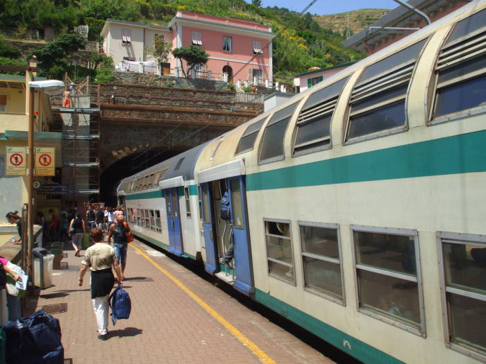 Train stopping at the Riomaggiore station in the Cinque Terre.