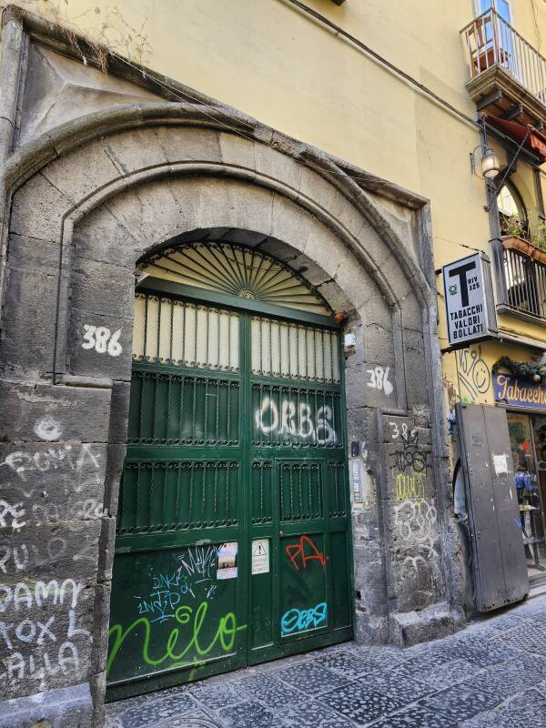 Heavy green steel door at the street.