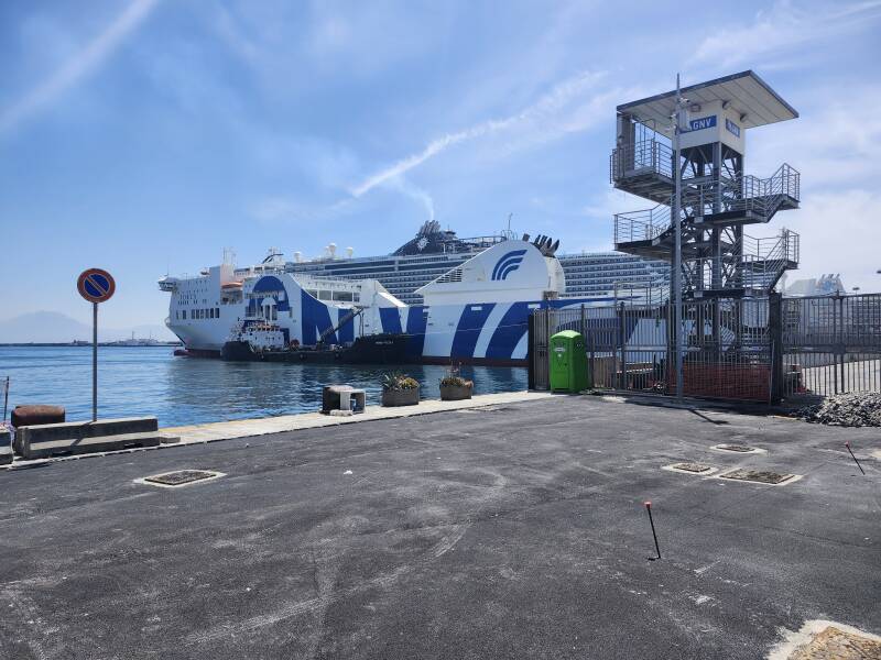 Large ferry and even larger cruise ship at the port.