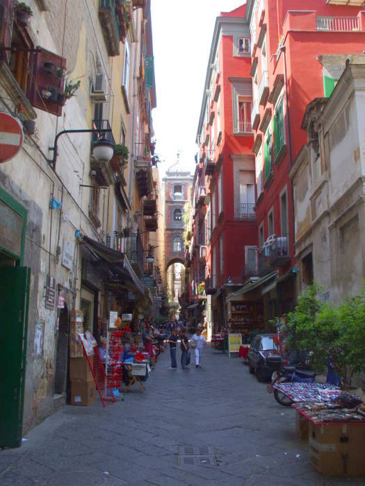 Bright red buildings with green shutters in Naple's Centro Storico.