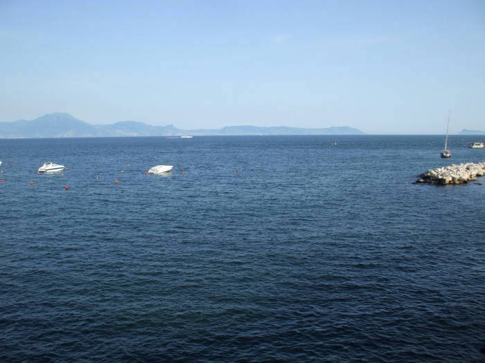 Sorrento Peninsula and the Isle of Capri, as seen from the Naples harbor.