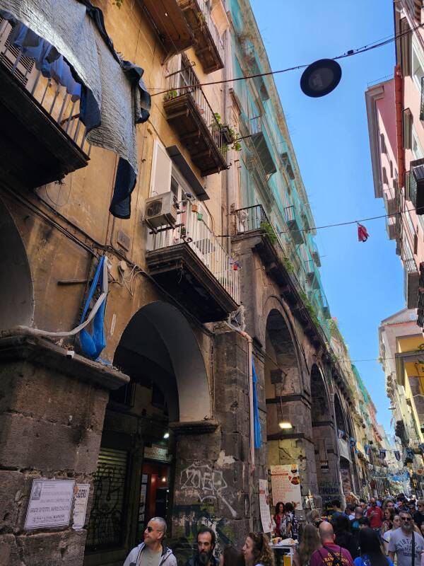 Cafes in archways along Via dei Tribunali.