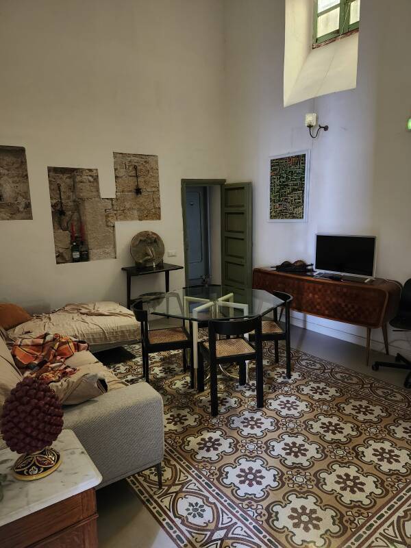 Room with TV and couches.