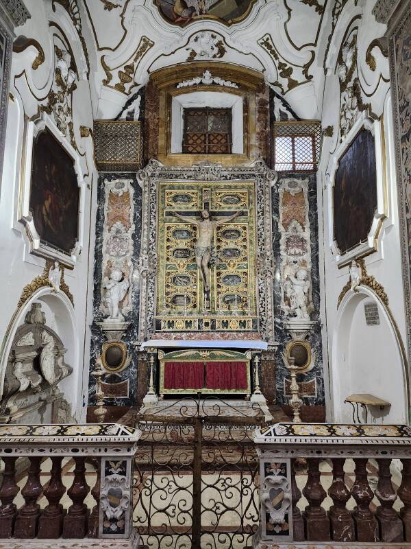 Crucifix on a cabinet of reliquaries.