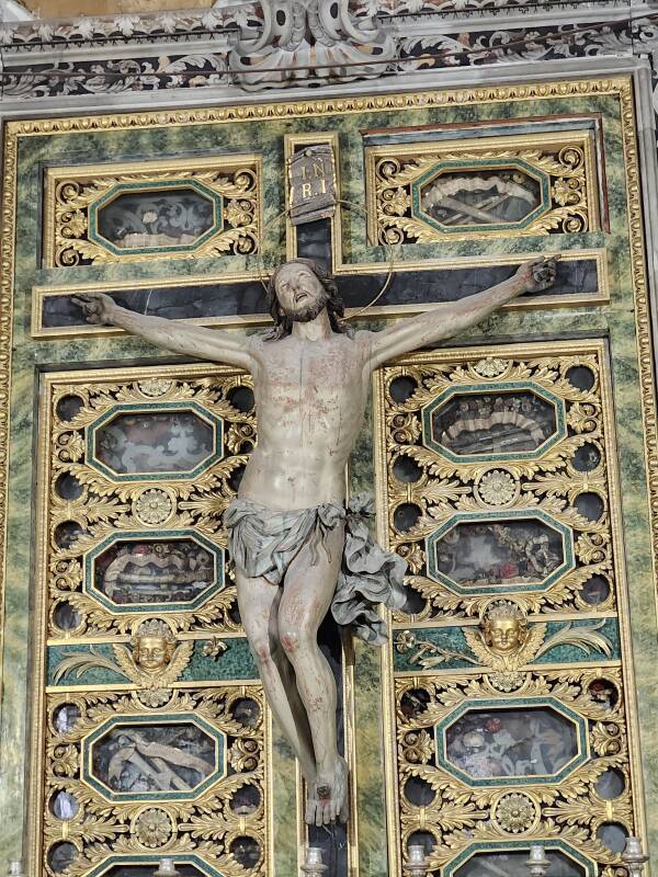 Crucifix on a cabinet of reliquaries.