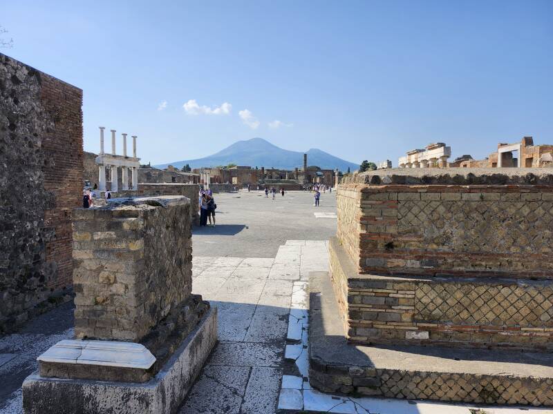 View to the north across the Forum toward the Temple of Jupiter and beyond that to Vesuvius.