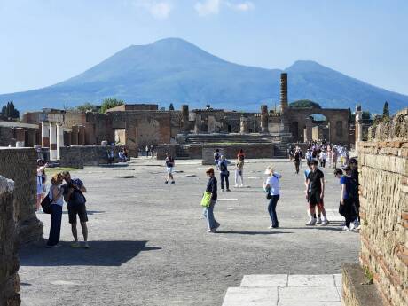 Forum in Pompeii with Vesuvius in the background.