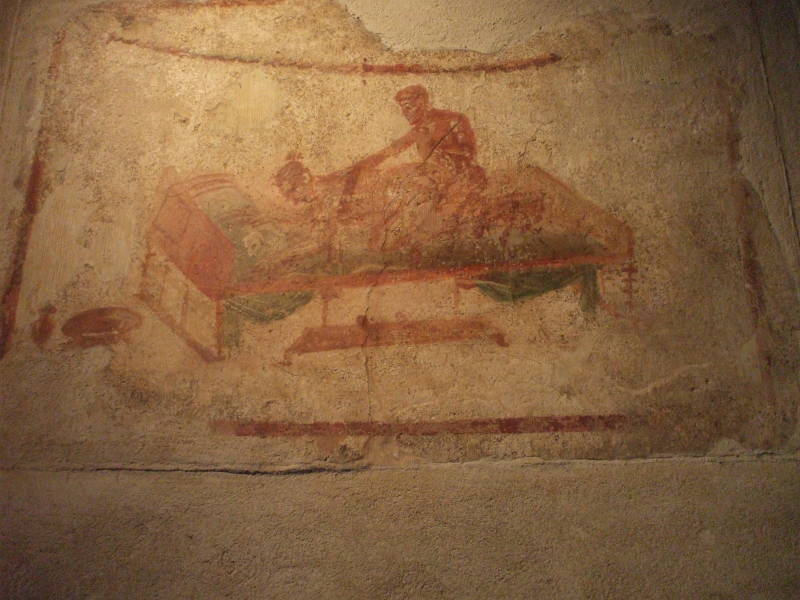 Erotic fresco in the Lupanare, a Roman brothel at Pompeii.