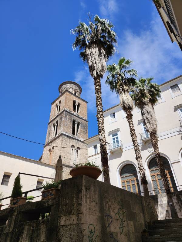 Exterior of Duomo beyond palm trees.