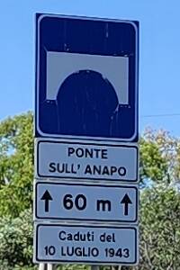 Highway sign and historical marker for the bridge.