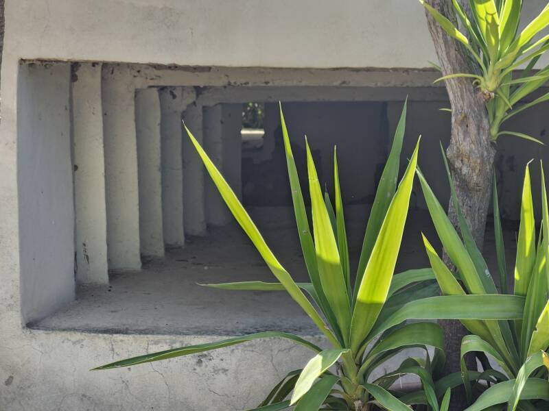 Reinforced concrete stepped edges on a machine-gun firing port.