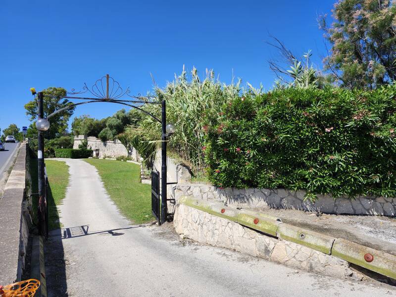 The new bridge at left, the approach to the old bridge at right, and the gravel lane up the center.