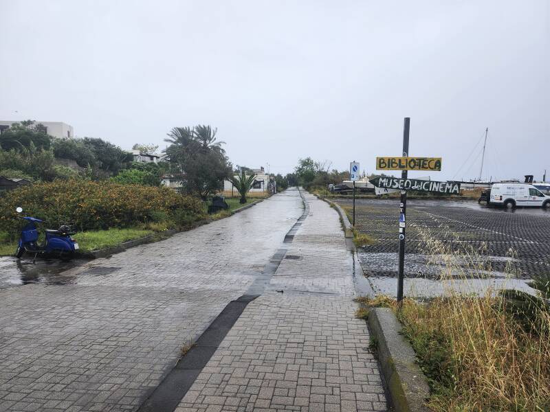 Walking along the waterfront lane past signs to the library and the Museum of Cinema.
