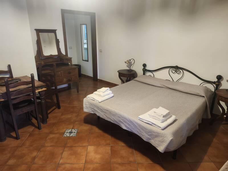 Bed and bathroom door.
