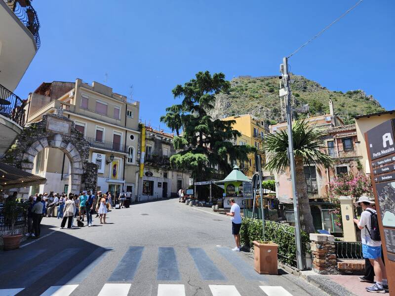 Porto Messina at left, peak with fortress in the distance.