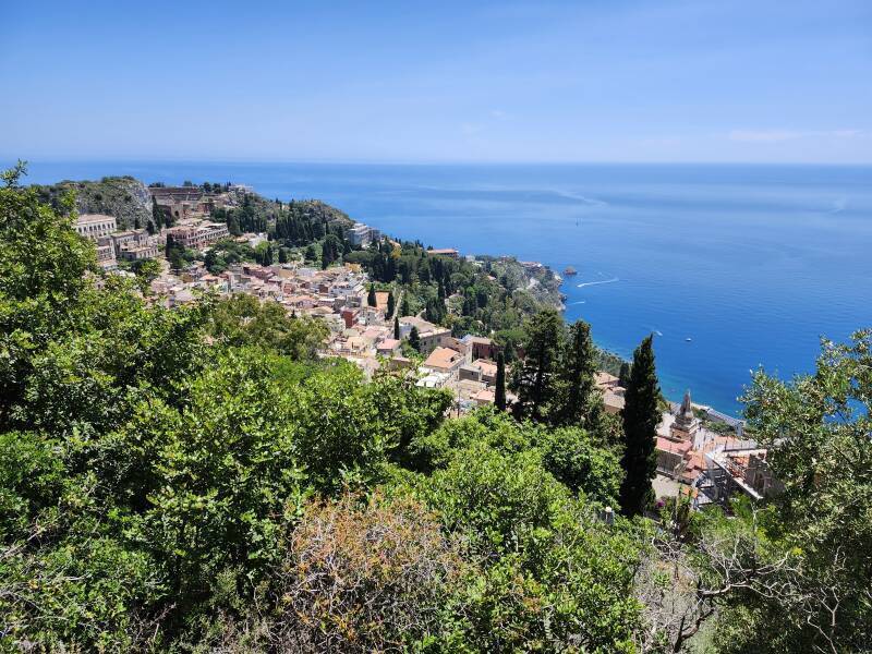View down over town with ancient Greek theatre and Chiesa di San Giuseppe clearly visible.