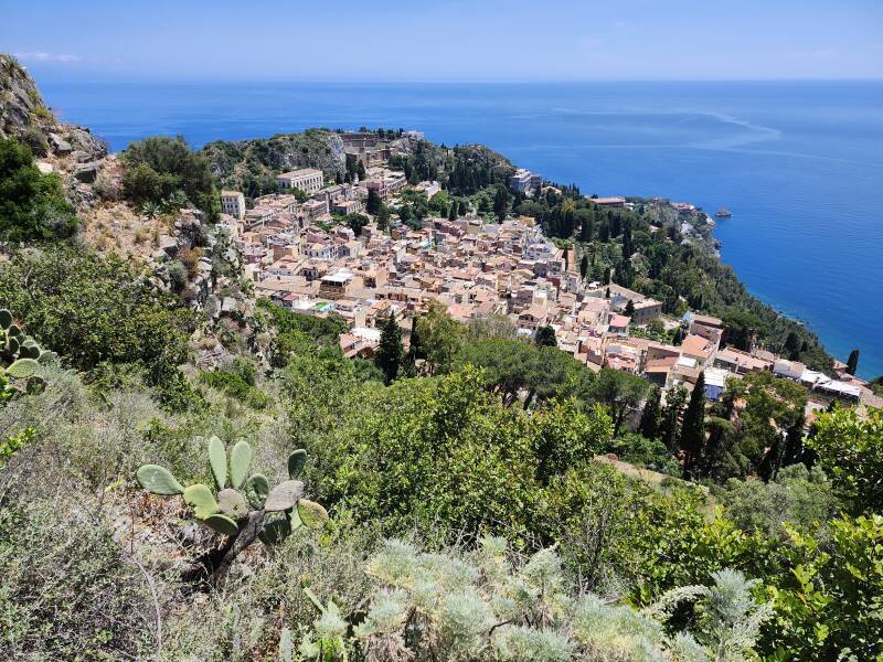 View down over town with ancient Greek theatre clearly visible.