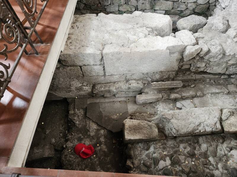 Idiot American's ball cap in the Hellenistic era ruins beneath the floor.