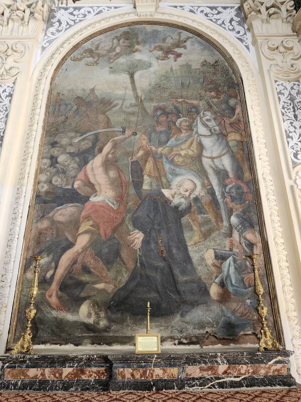Painting of the martyrdom of San Nicone in the Church of Saint Pancras.