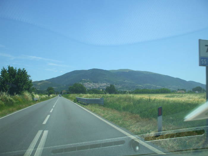The view out the windshield while driving from Perugia to Assisi.
