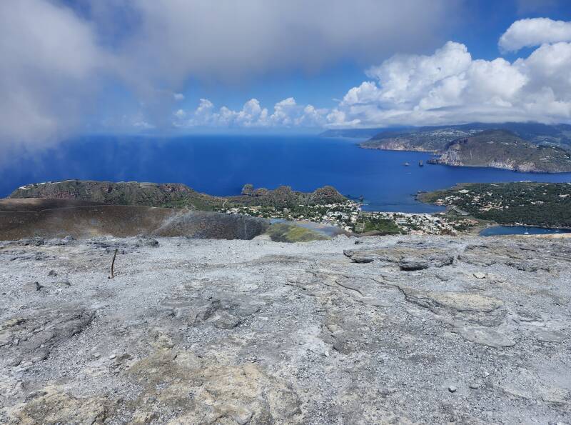 A cloud passes over the crater, its base lower than the peak.