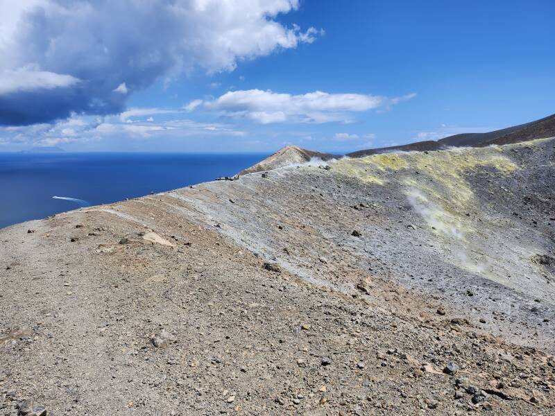 People along the crater rim near the vents and the sulfur deposits.