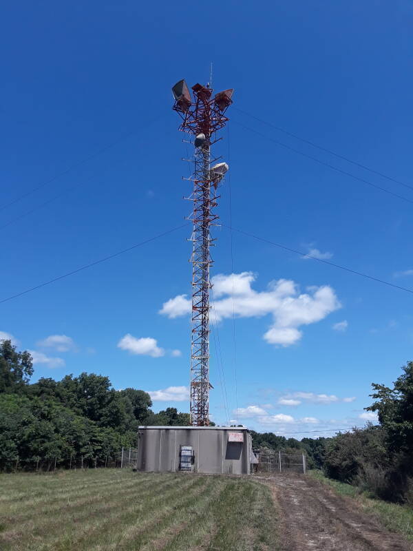 Telecommunications tower with old horn antennas disconnected but still in place, along US 231 in Indiana.