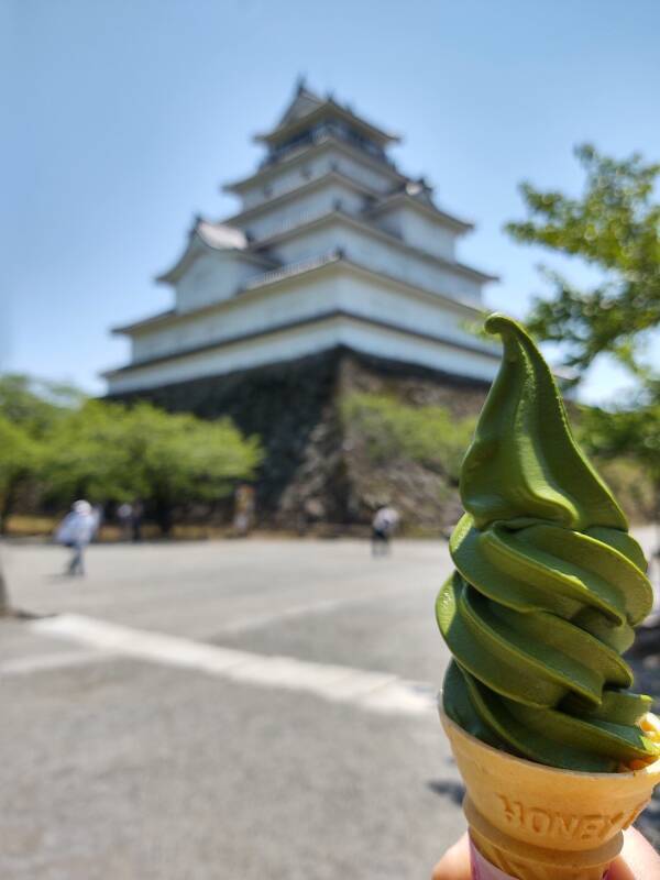 Green matcha tea ice cream and the tenshu or keep of Tsuruga Castle in Aizu-Wakamatsu.