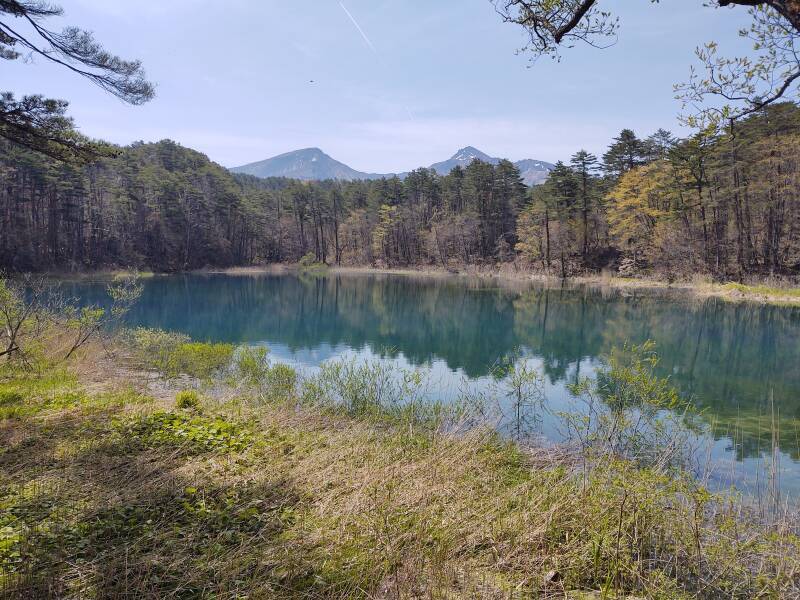Ruri-numa Pond with peaks of Mount Bandai in the distance, among Goshi-ki-numa or the Five-Colored Lakes.