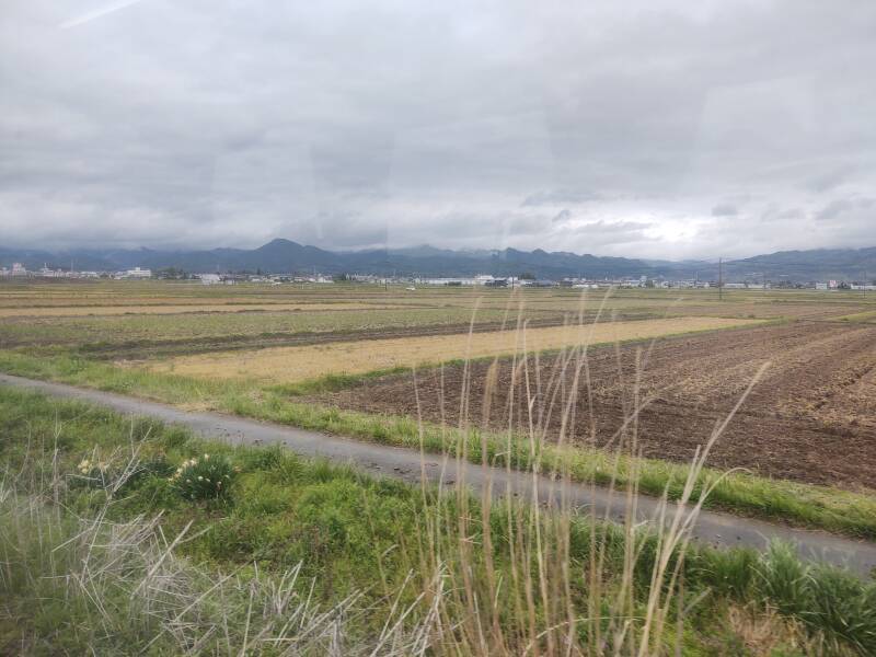 Misty mountains seen from the train from Aizu-Wakamatsu to Kitakata.