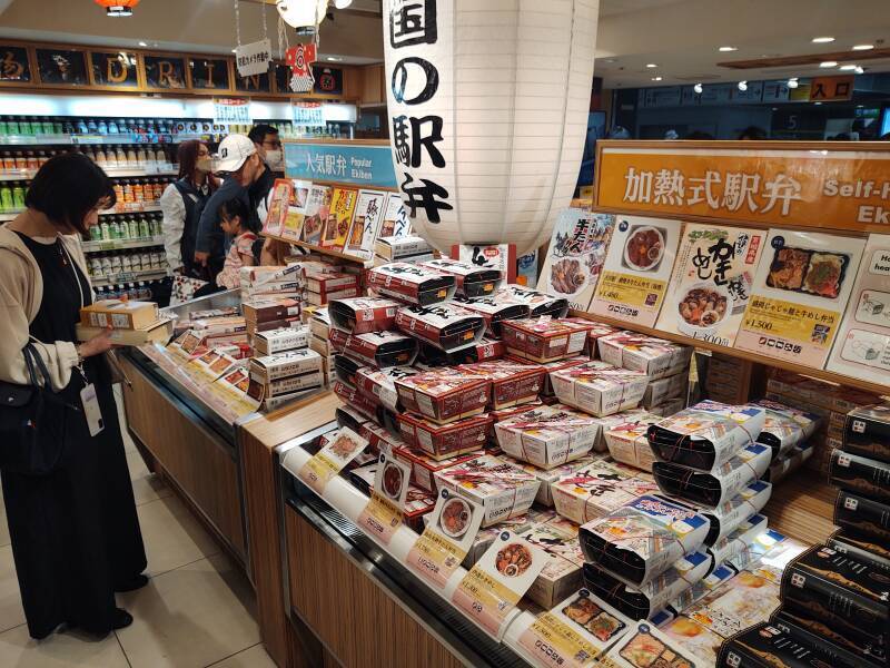 Selecting from a wide array of bento lunch boxes at Tōkyō Station.