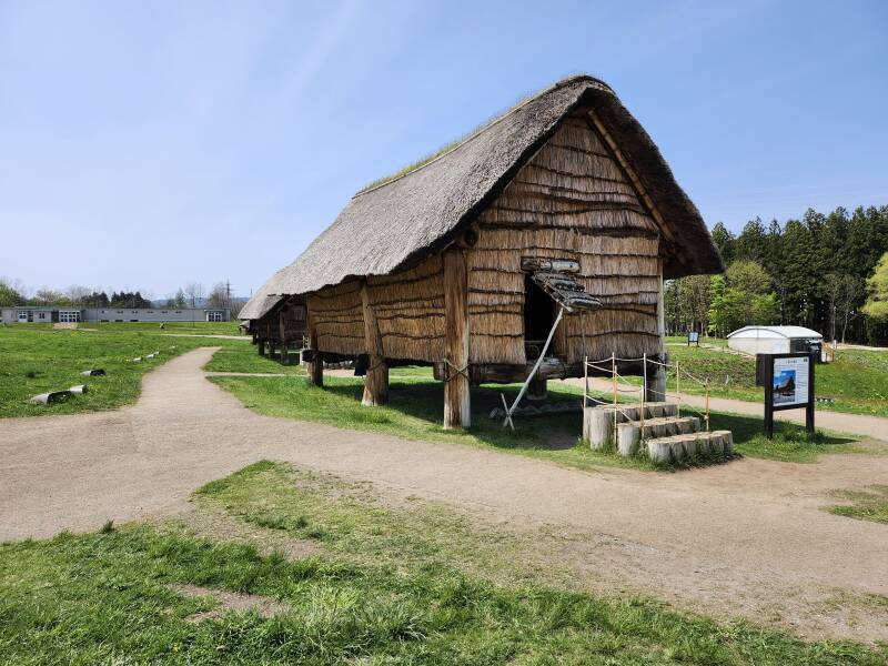 Large structure with floor elevated above ground level.