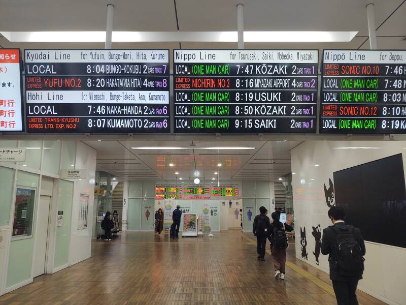 Schedule board in Ōita Station, briefly showing English details.