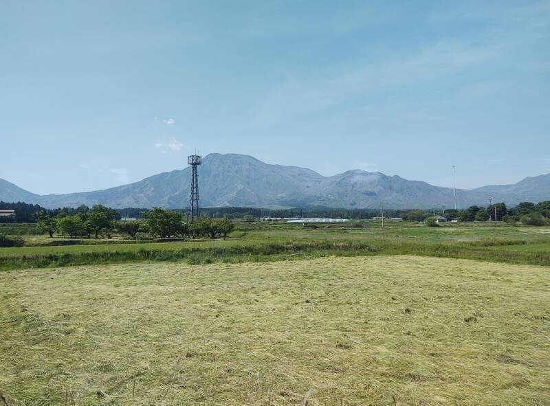 Seeing Mount Aso from on board the Trans-Kyūshū Limited Express train as it crosses Aso Caldera.